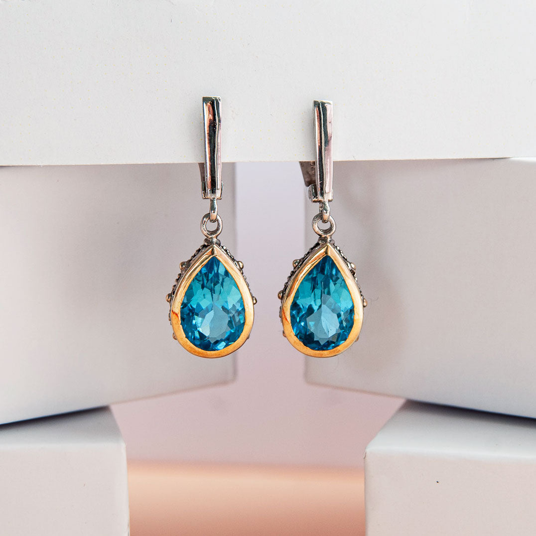 עגיל כסף "שיה" עם אבני בלו טופז