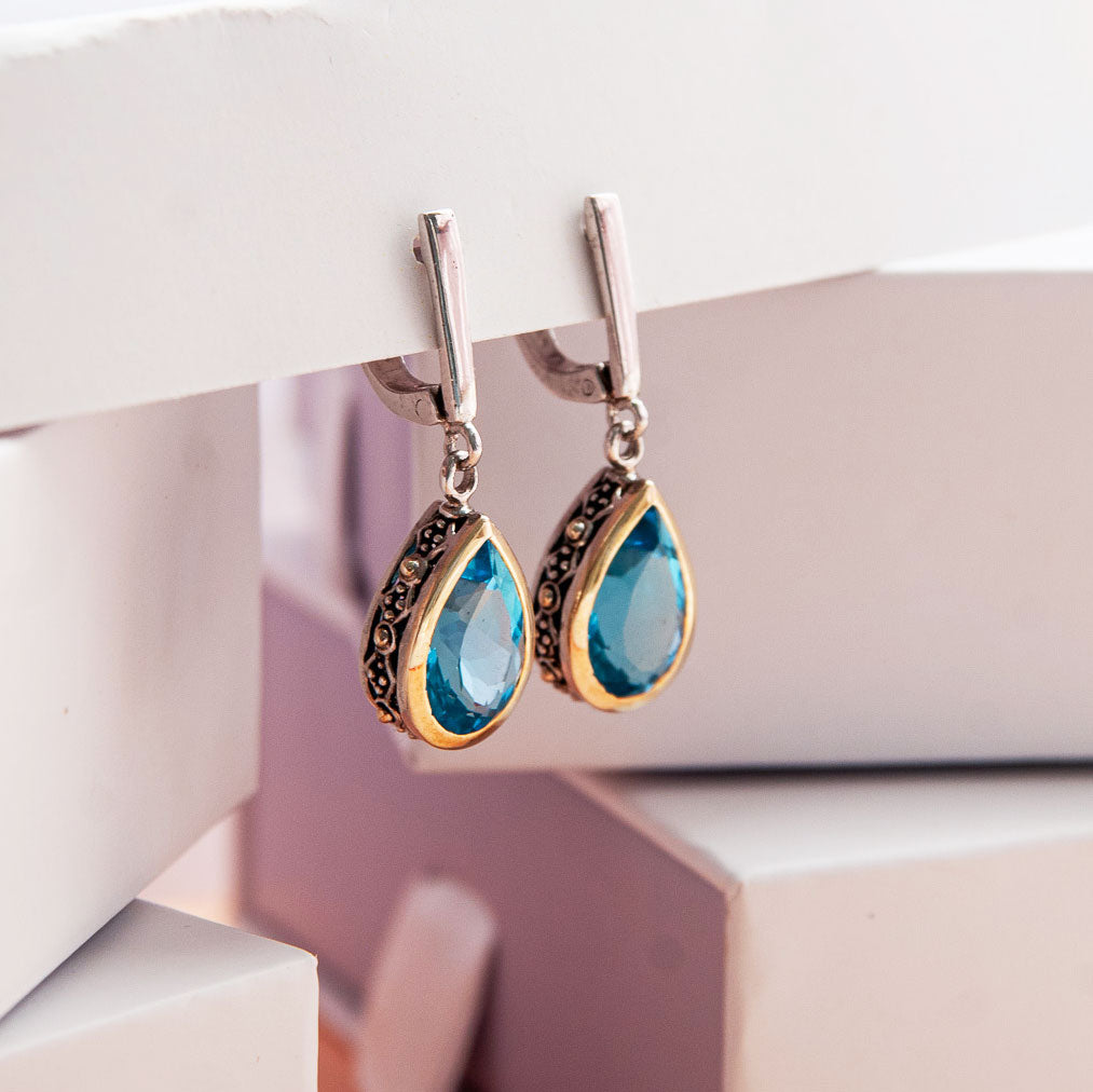 עגיל כסף "שיה" עם אבני בלו טופז