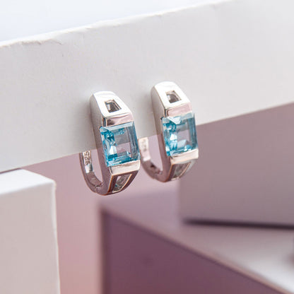 עגילי כסף "מונה" עם אבני בלו טופז