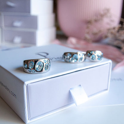 טבעת כסף טהור "שרלוט" עם אבני בלו טופז