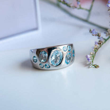 טבעת כסף טהור "שרלוט" עם אבני בלו טופז